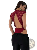 A deep red lace v-neck bodysuit with a scalloped back and cutout design shown from the back side