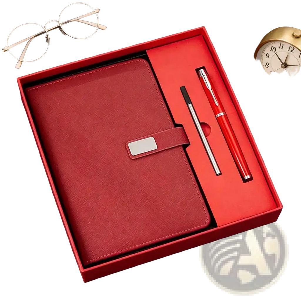 Red leather corporate gift notebook with silver clasp in matching red gift box alongside two pens