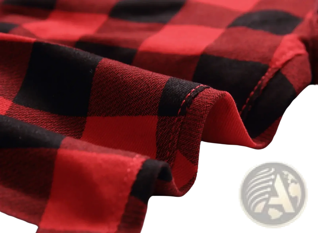 Red plaid slim fit denim jeans featuring red and black plaid flannel fabric with visible stitching along the fold