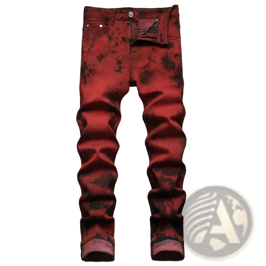 Red plaid slim fit denim jeans featuring red tie-dye fabric with dark splatter patterns and rolled cuffs