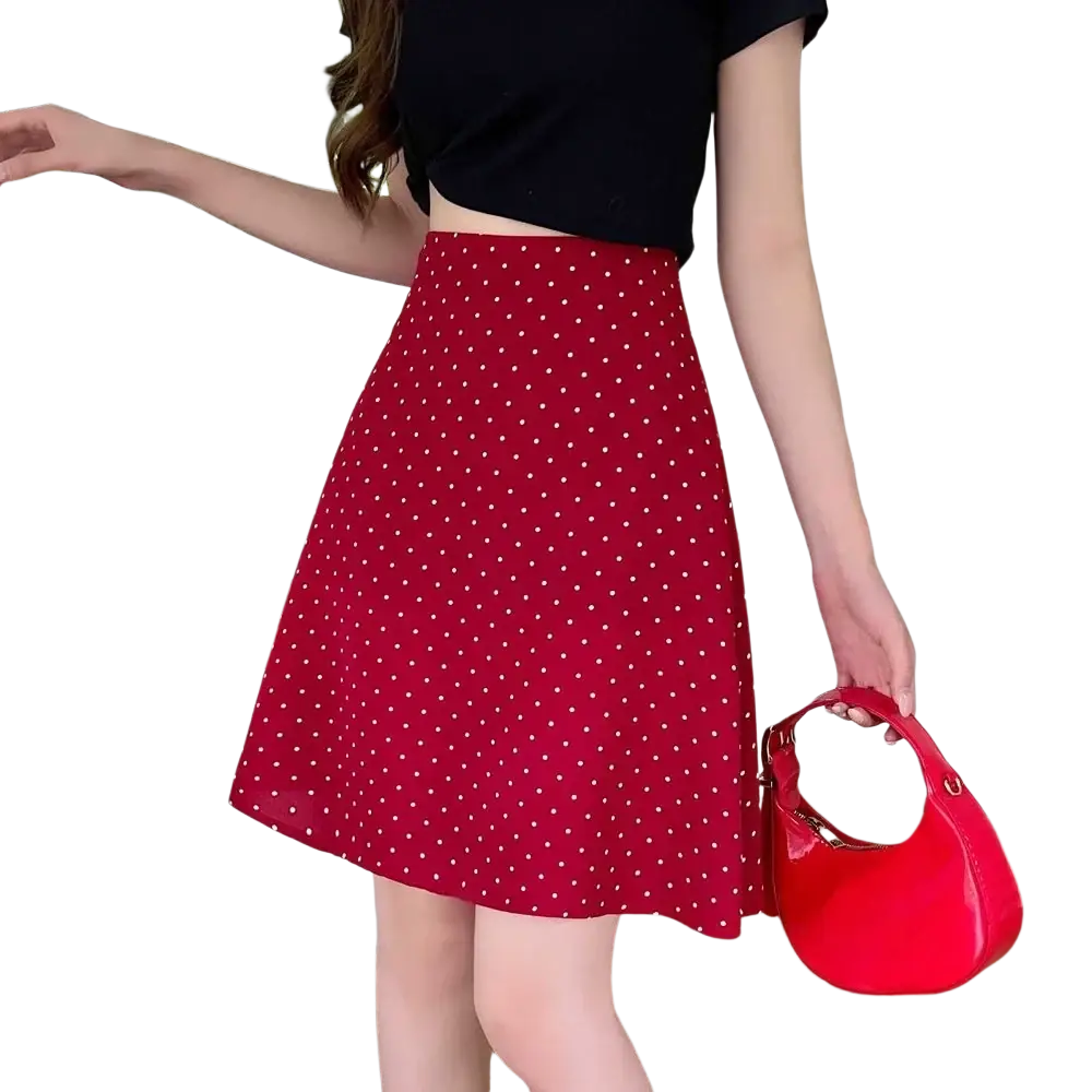 Red polka dot a-line midi skirt with white dots and a fitted waistband in lightweight fabric for casual wear