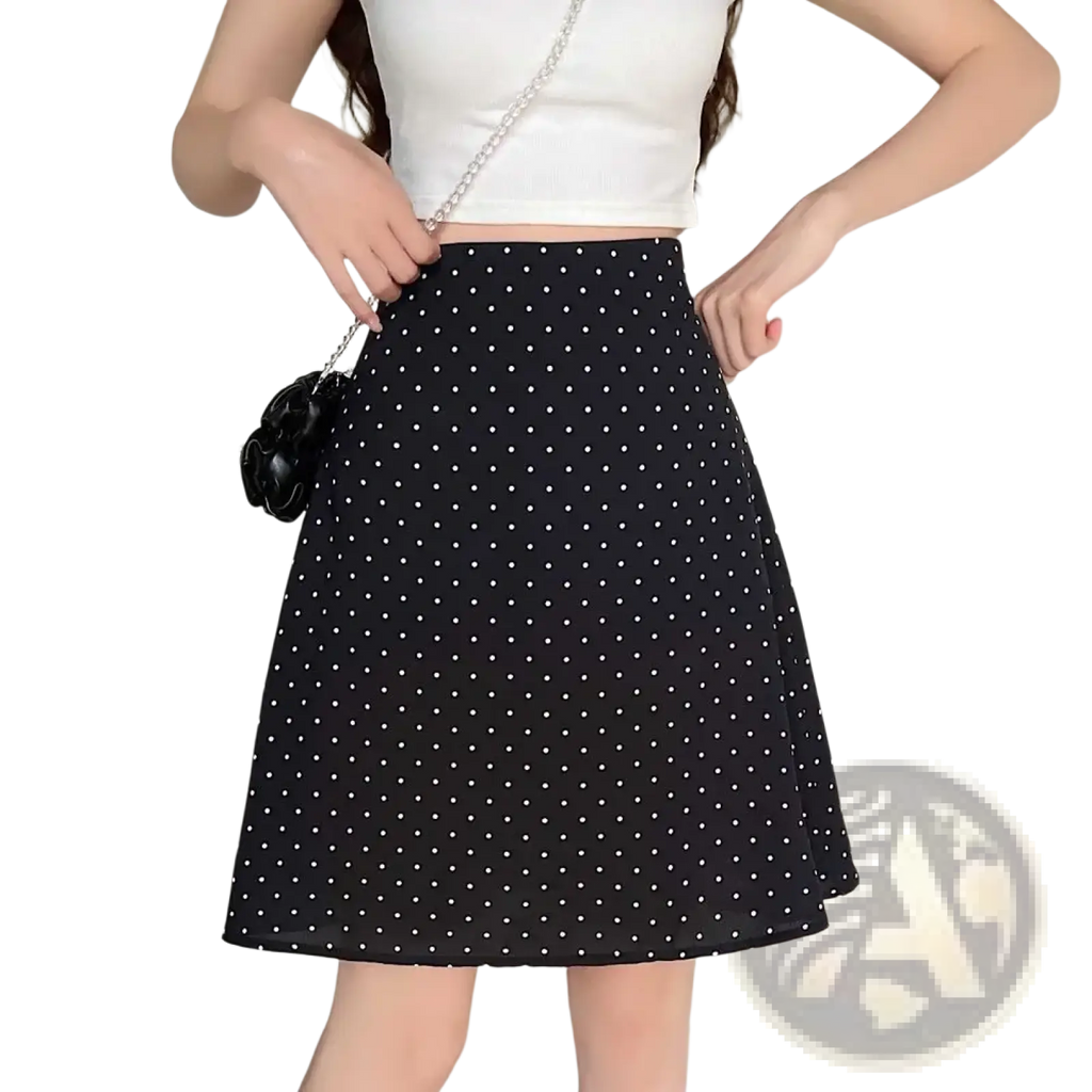 Black a-line midi skirt with white polka dots and flared hem contrasting the red polka dot design