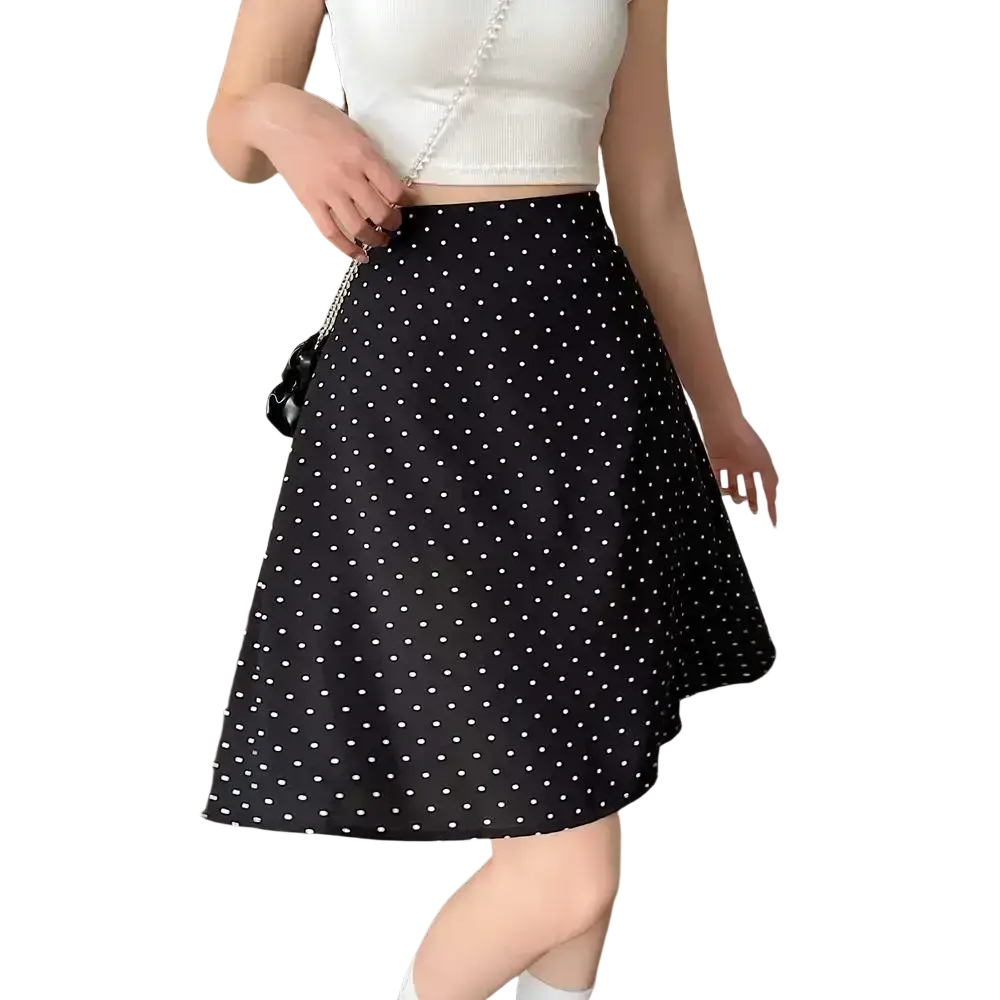 Black polka dot a-line midi skirt featuring white dots on a flowy fabric perfect for casual or formal wear