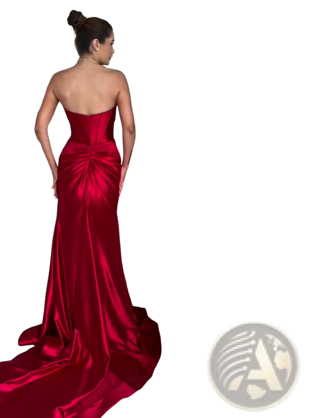 A striking crimson satin strapless mermaid evening gown with a fitted bodice and dramatic train