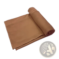 Tan fleece blanket with soft plush texture neatly rolled complementing red stretchy turban headwrap for women