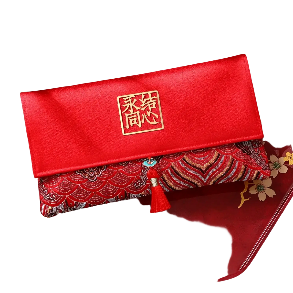 Red wedding envelope satin money gift bag featuring red satin clutch with gold embroidered 永结同心 seal and tassel accent
