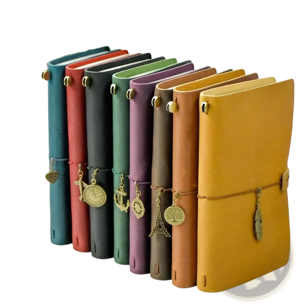 A collection of colorful refillable genuine leather travel journal notebooks with unique metallic charms