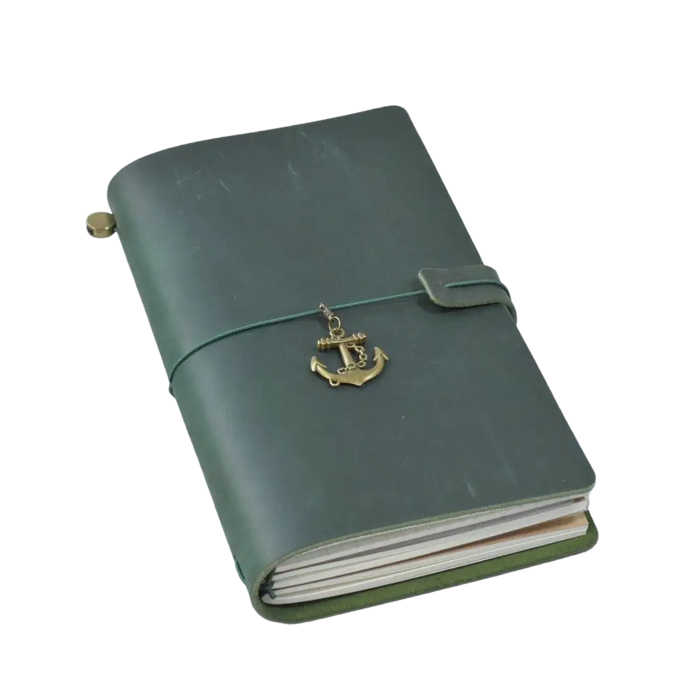Refillable genuine leather travel journal notebook in dark green with a brass anchor charm on elastic band