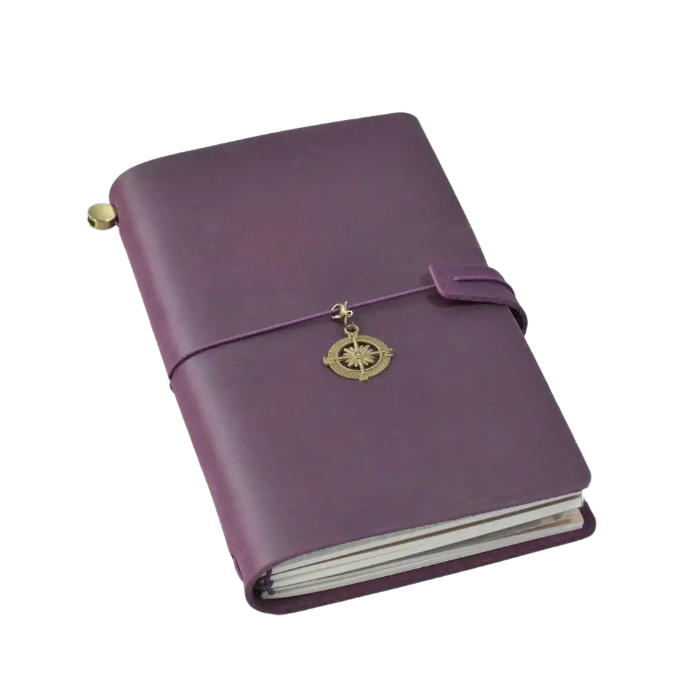 Purple refillable genuine leather travel journal notebook with leather binding and brass compass charm on elastic band