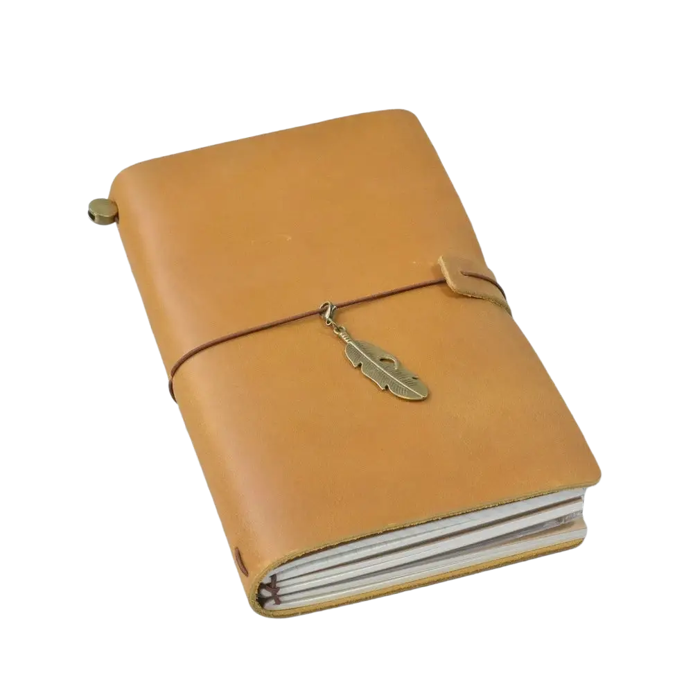 Refillable genuine leather travel journal notebook in tan with brass feather charm and brown cord closure