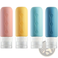 Four pastel-colored refillable silicone travel bottles with leakproof clear caps and wavy embossed design