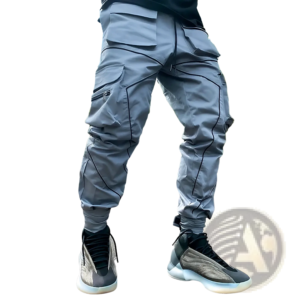 Reflective cargo joggers men activewear pants in gray with black stitching and multiple pockets worn with matching sneakers