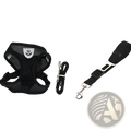 Reflective mesh black dog harness with silver paw emblem and matching leash with car seat belt clip attachment