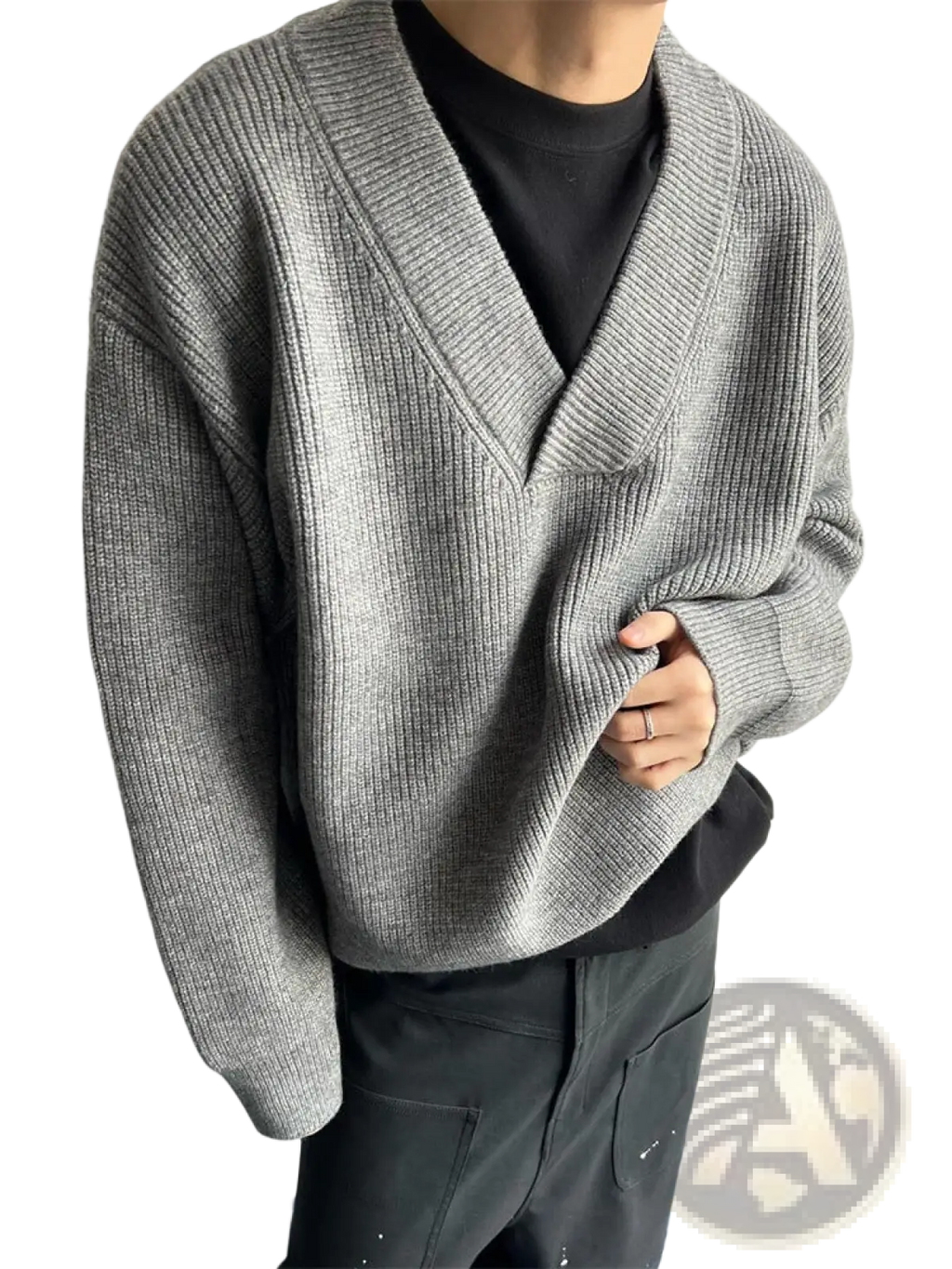 Gray ribbed knit relaxed v-neck pullover sweater worn over a black tee showcasing a casual layered look