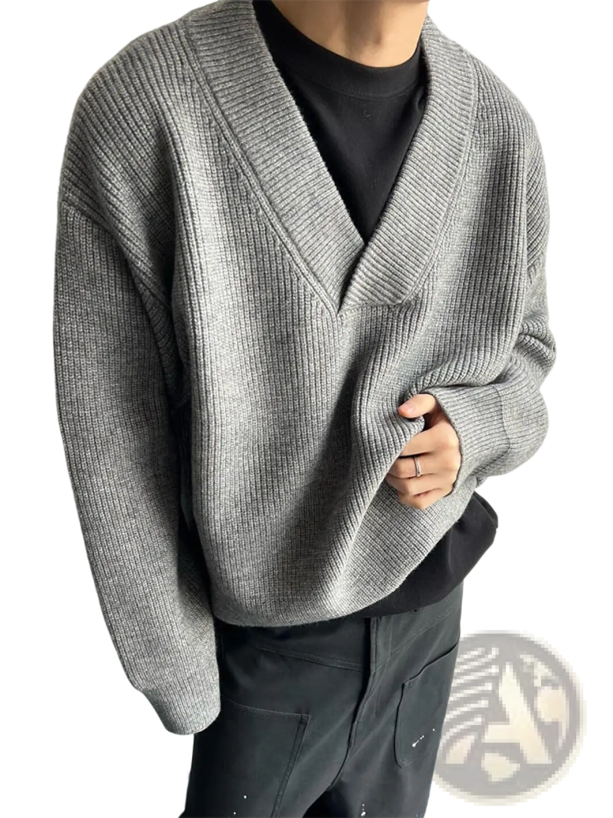 Gray ribbed knit relaxed v-neck pullover sweater worn over a black tee showcasing a casual layered look