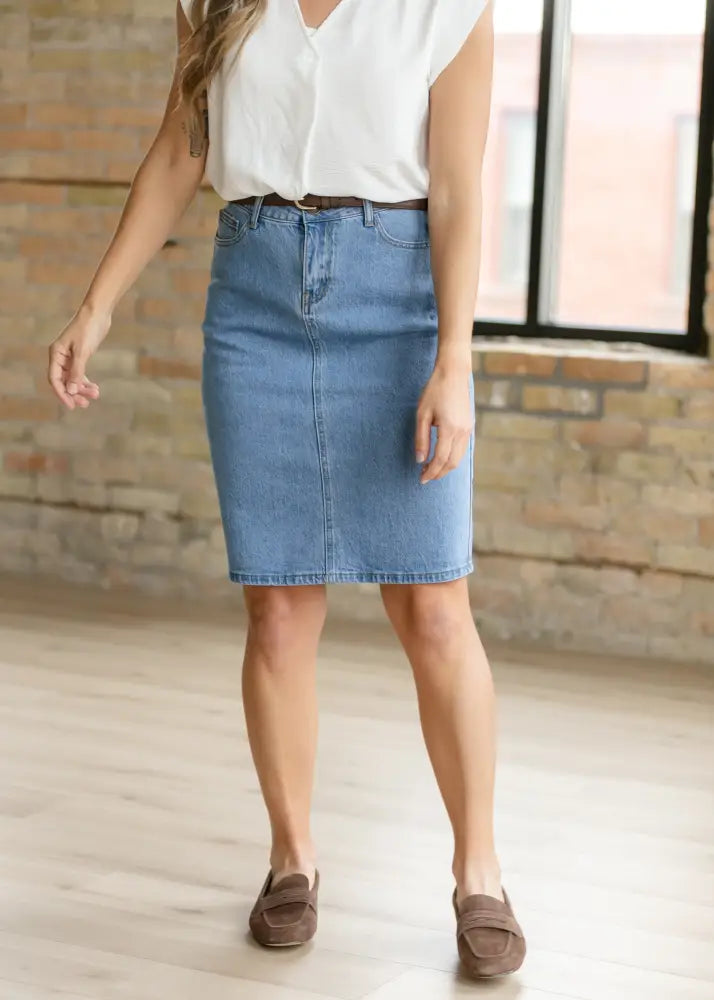 Remi classic wash stretch denim midi skirt in light blue with mid-thigh length and button zipper front closure