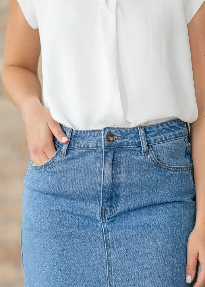 Remi classic wash stretch denim midi skirt in medium-wash blue with classic stitching and button closure