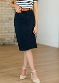 Remi navy high waisted stretch denim midi pencil skirt with front pleats and a straight hem