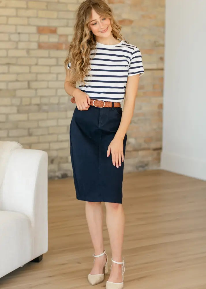 Navy high waisted stretch denim midi pencil skirt with front pocket and belt loop for a polished look