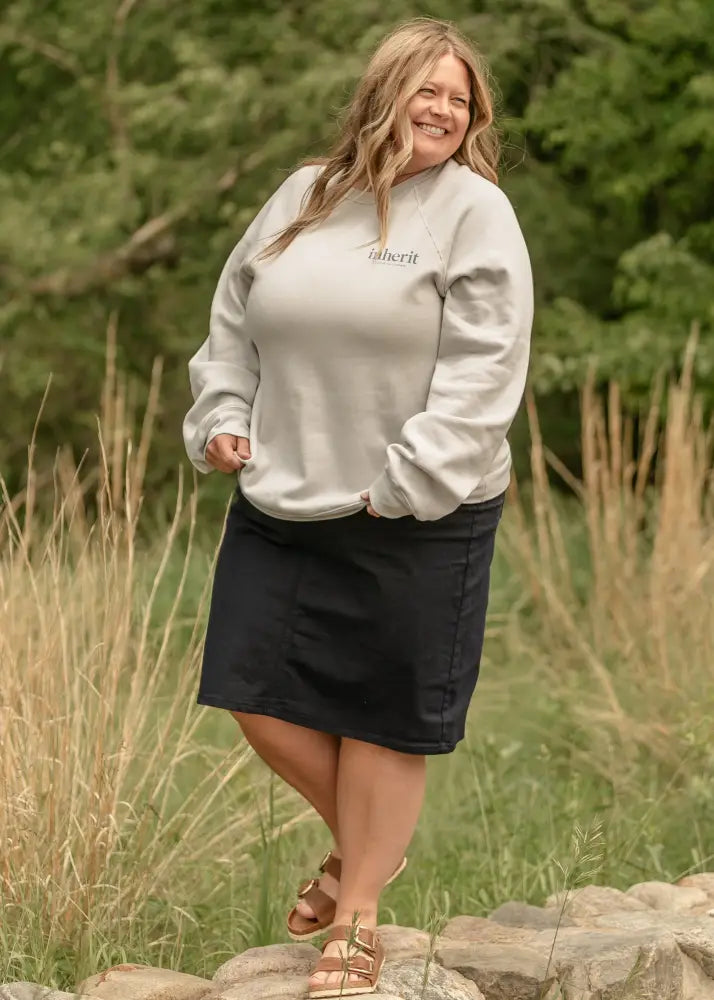 A soft light gray oversized hoodie with subtle inheri logo paired with remi navy high waisted stretch denim midi skirt