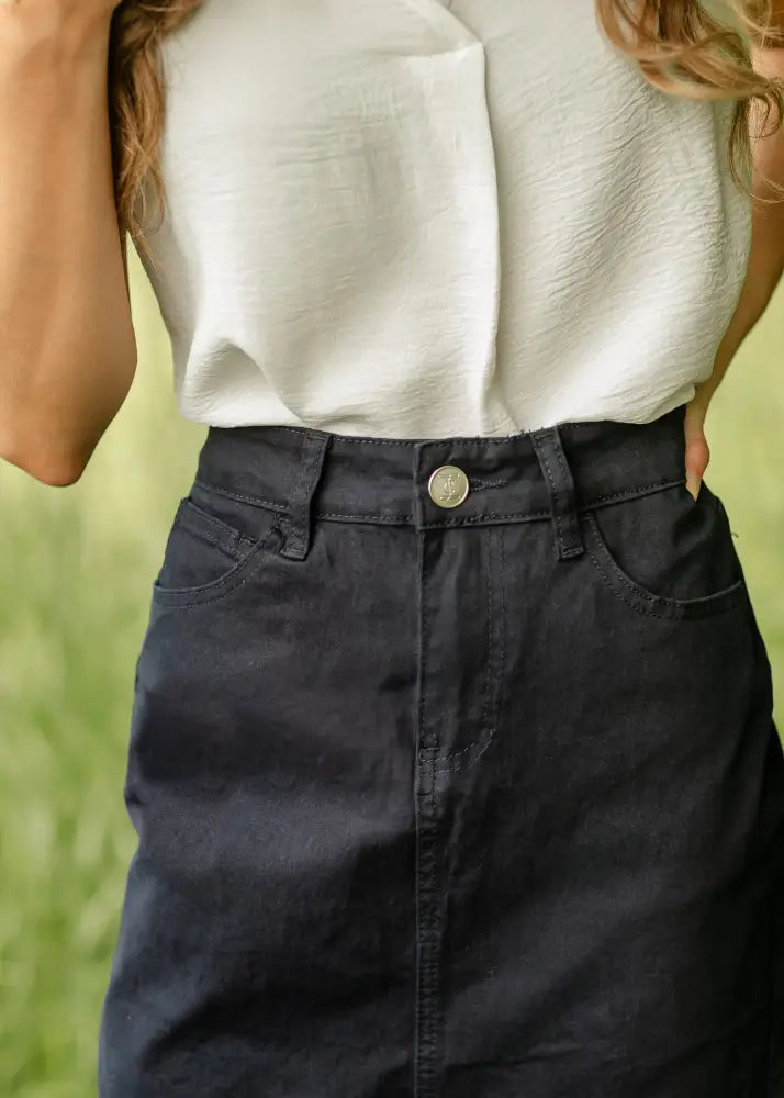 Remi navy high waisted stretch denim midi pencil skirt in dark denim with classic five-pocket design and silver button