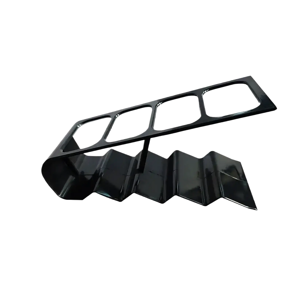 Black glossy plastic remote control organizer desktop storage rack with zigzagged lower section and rectangular cutouts