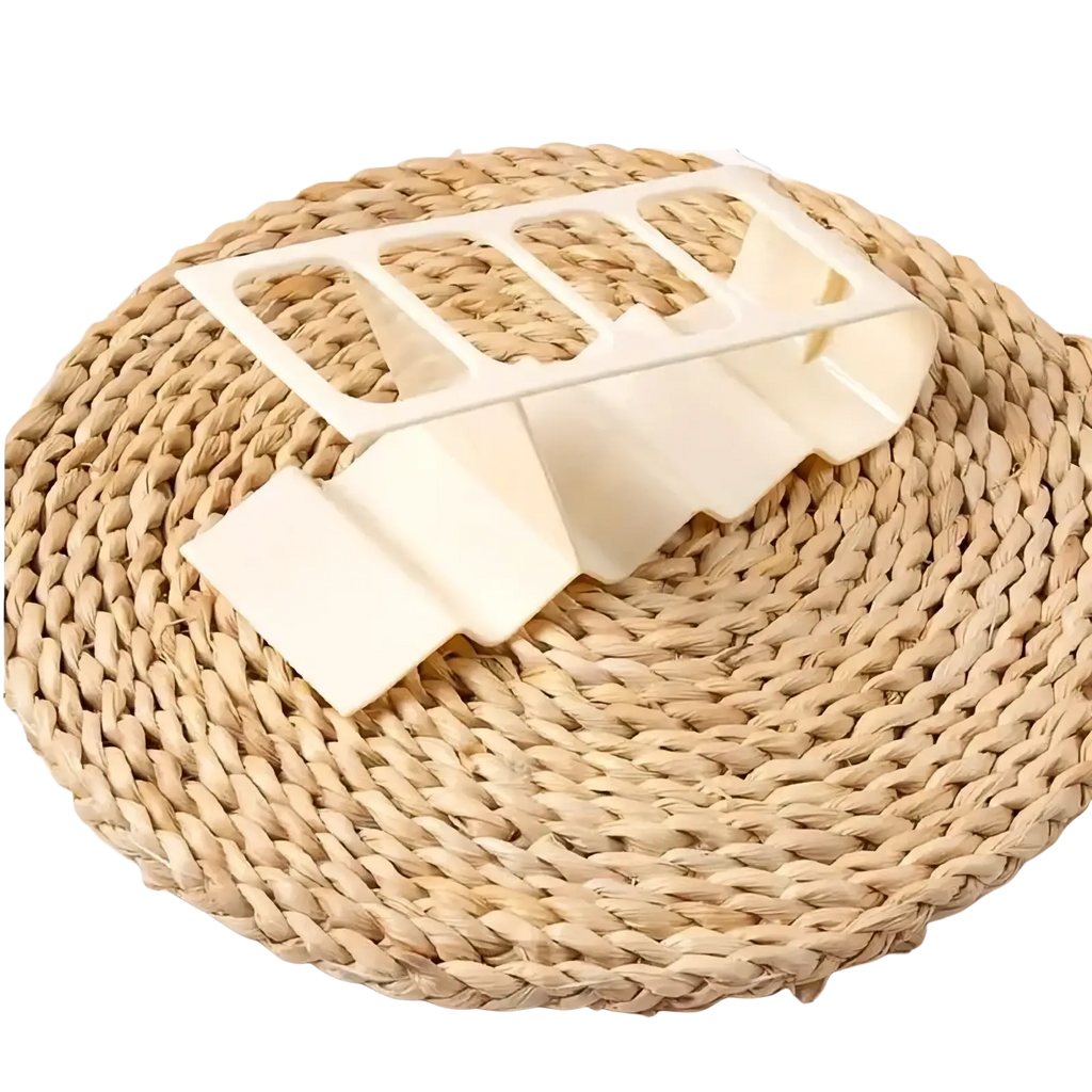 Cream-colored plastic remote control organizer desktop storage rack with five compartments and ergonomic curved design