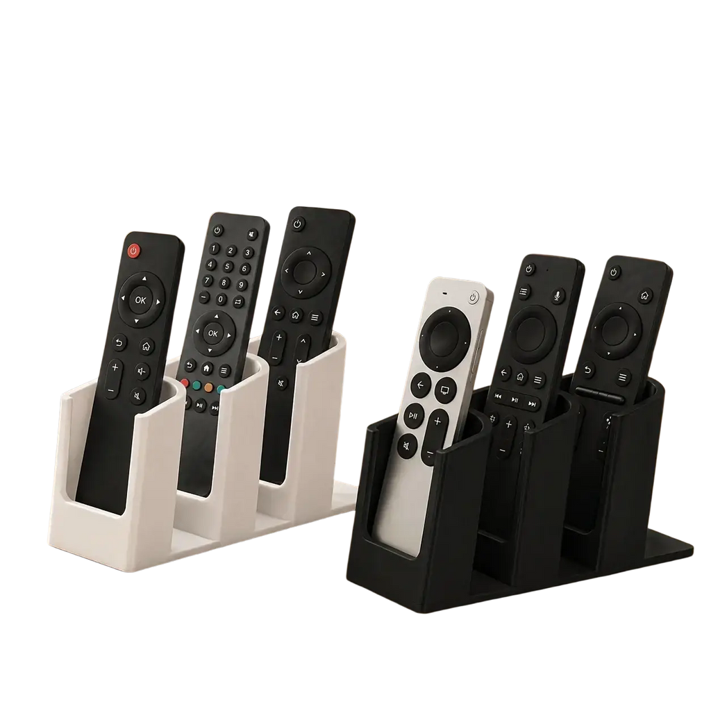 White and black plastic remote control organizer with three slots for neatly storing multiple remote controls
