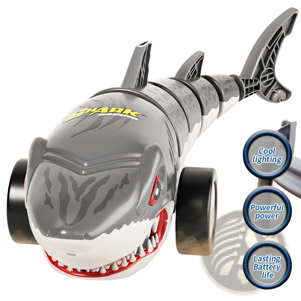 Remote control shark toy car in gray and white plastic with red eyes sharp teeth and black wheels