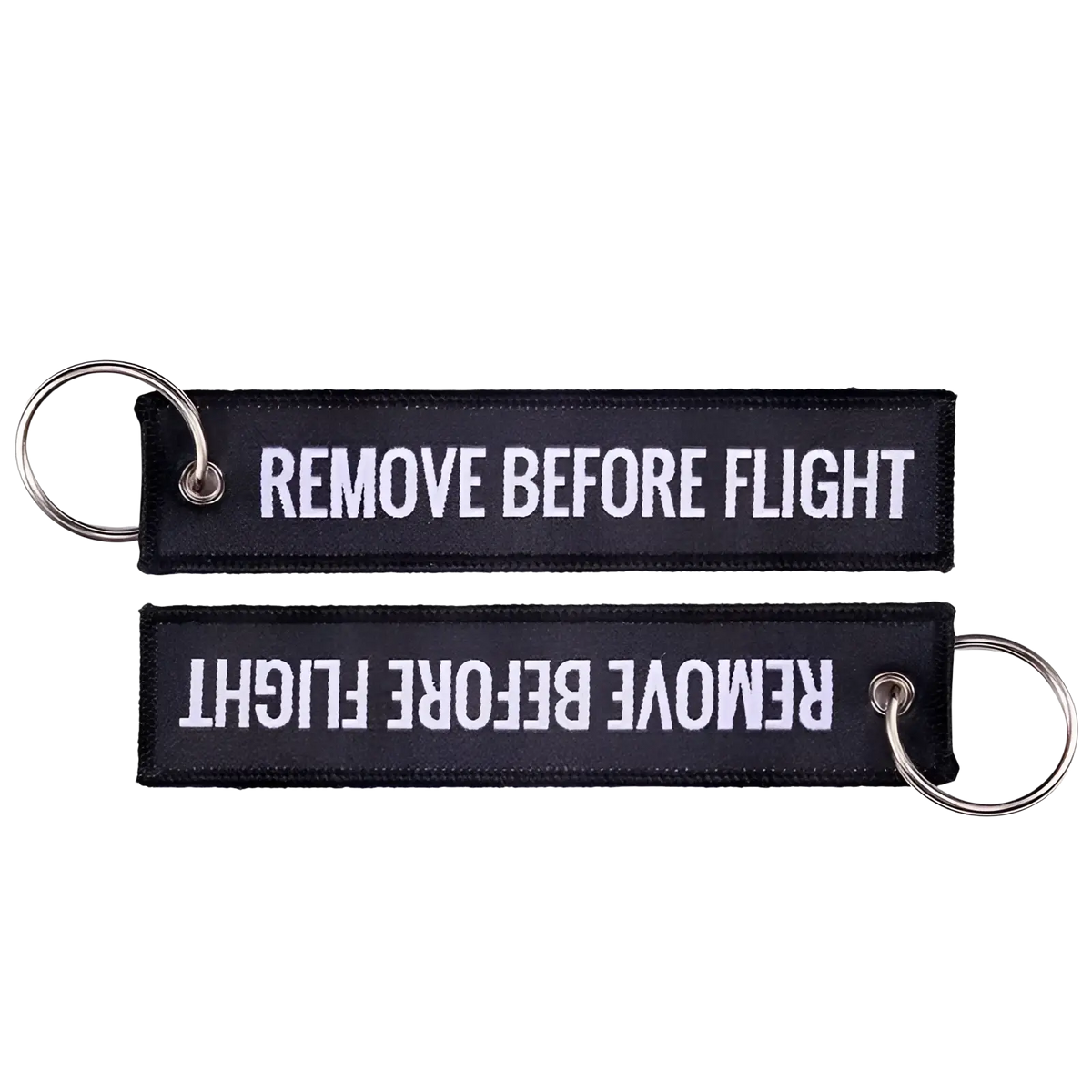 Black embroidered remove before flight keychain with white text and silver metal ring for aviation use