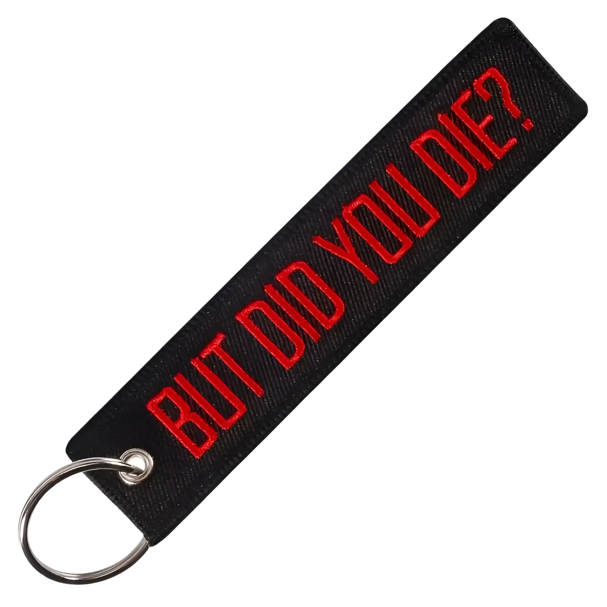 Black embroidered remove before flight keychain with red thread reading but did you die and silver metal ring