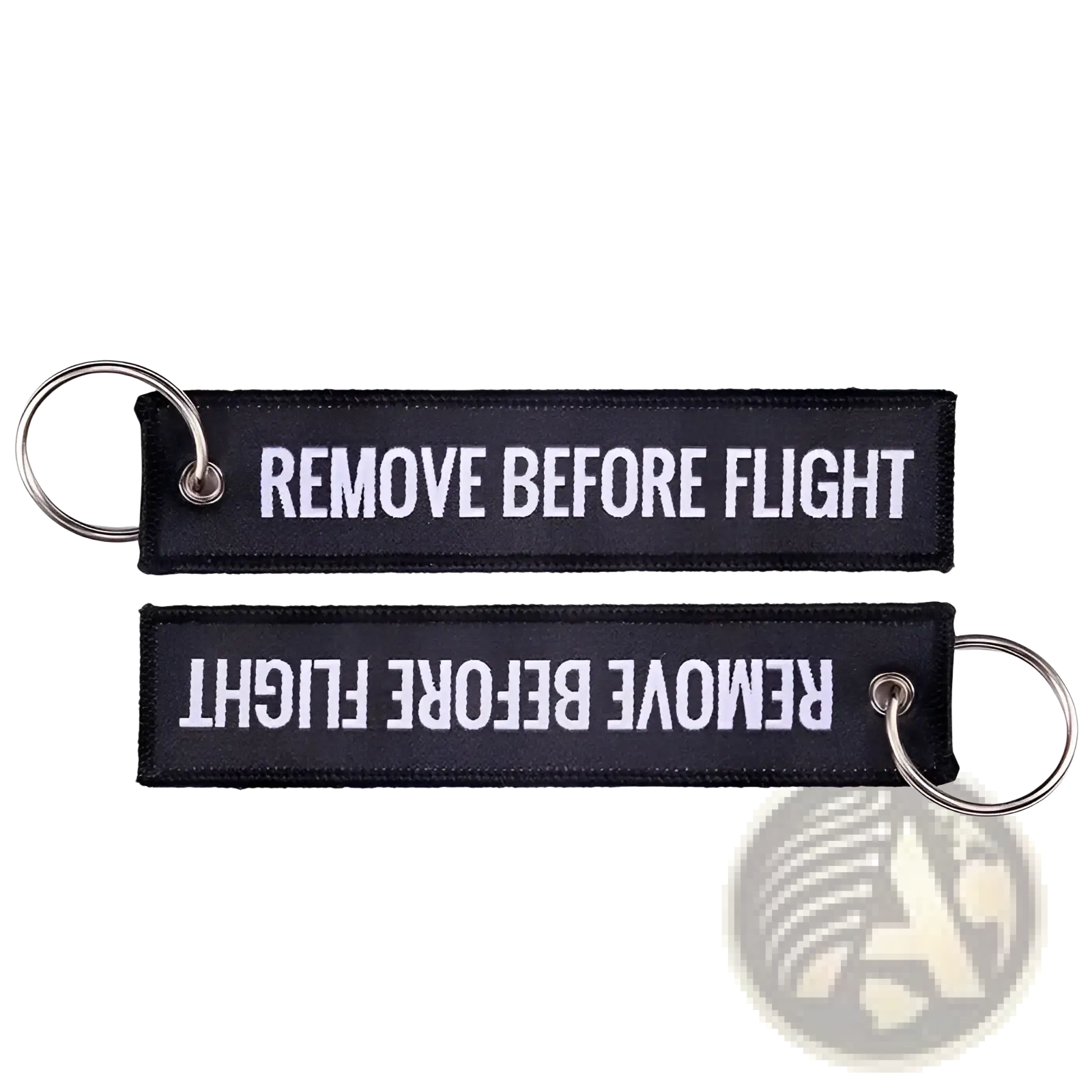 Black embroidered remove before flight keychain with white text and silver metal ring for aviation use
