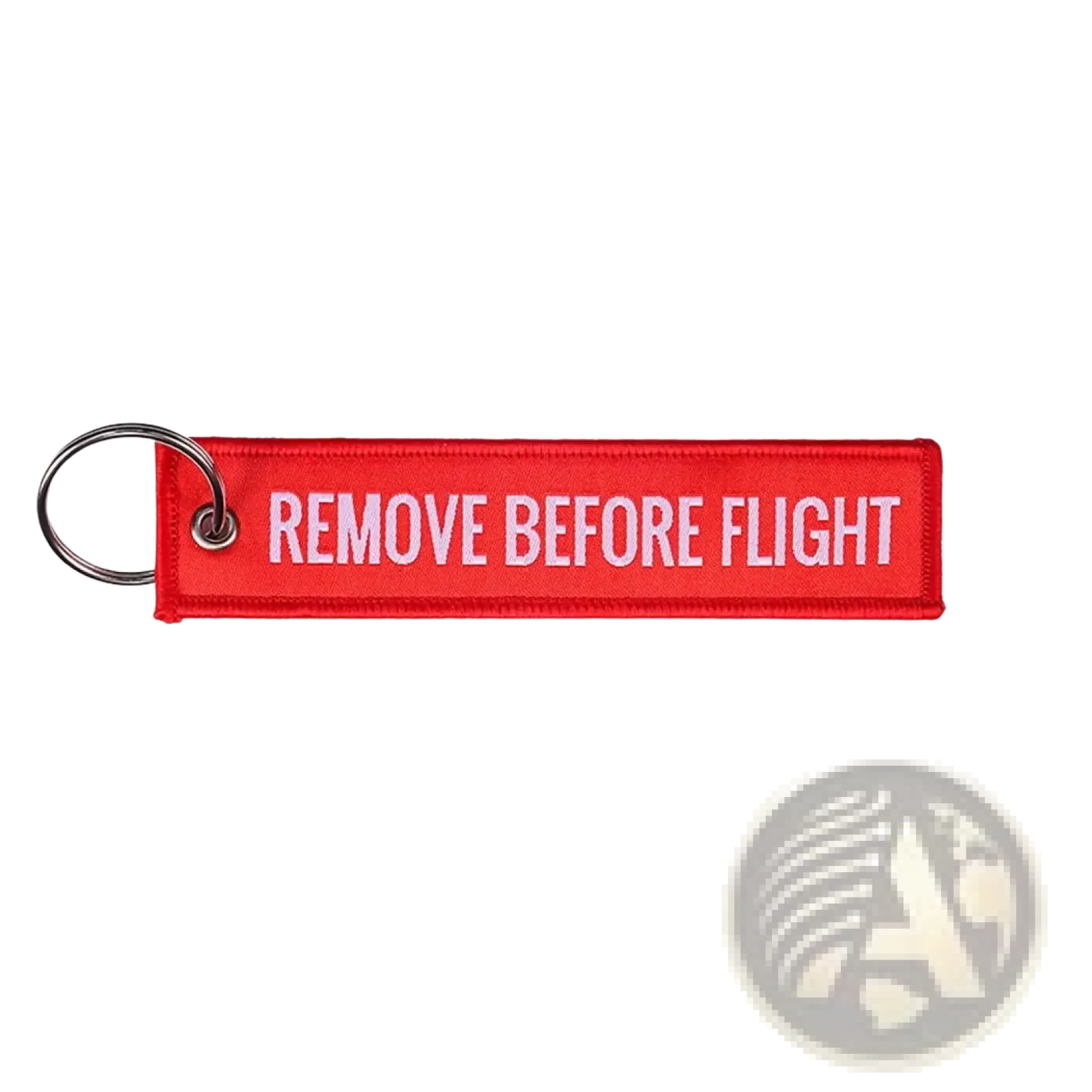 Red embroidered remove before flight keychain with white text and metal ring for aviation safety purposes