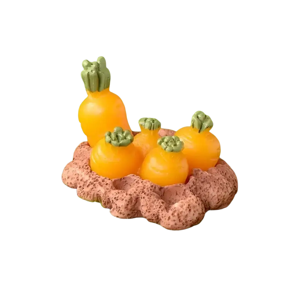 Resin bunny figurine with orange carrot details and green tops nestled in a brown base for easter garden decor