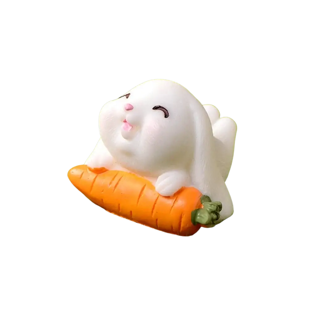 Resin white plush bunny figurine with closed eyes holding orange carrot ideal for easter garden and cake decor