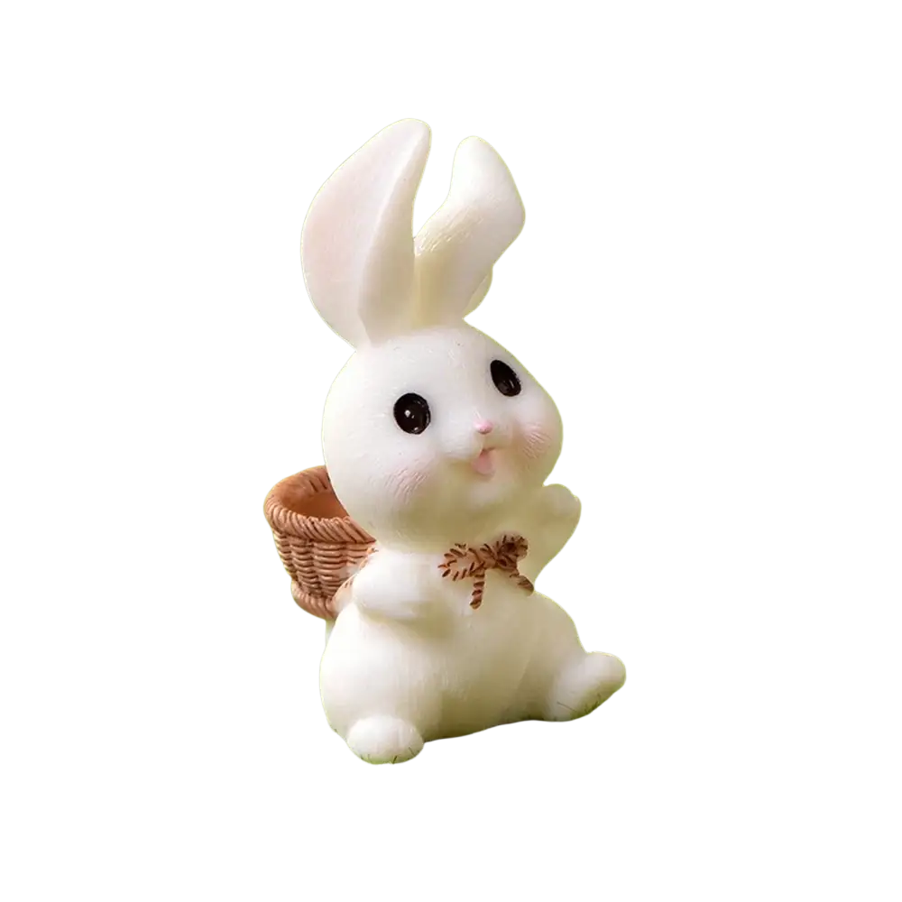White resin bunny figurine with black eyes and pink nose carrying a small woven basket for Easter garden and cake decor