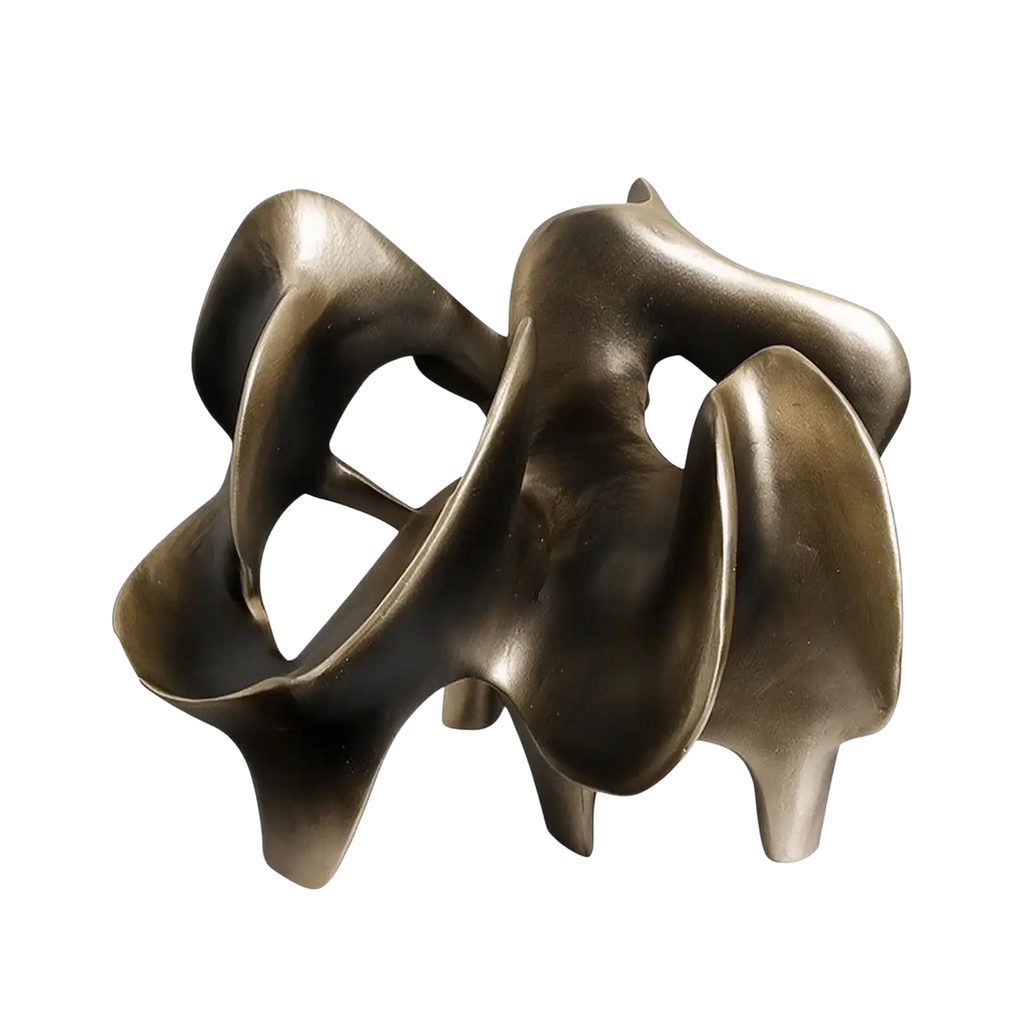 Abstract geometric gold resin decorative item featuring a polished bronze sculpture with flowing intertwined forms