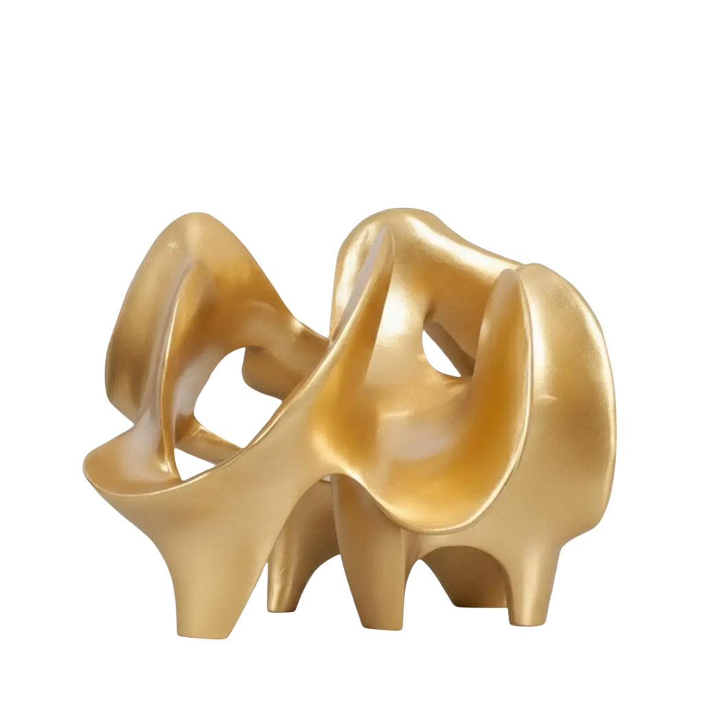 Golden glossy resin decorative item of abstract high-heeled shoes with flowing sculpted forms and modern design