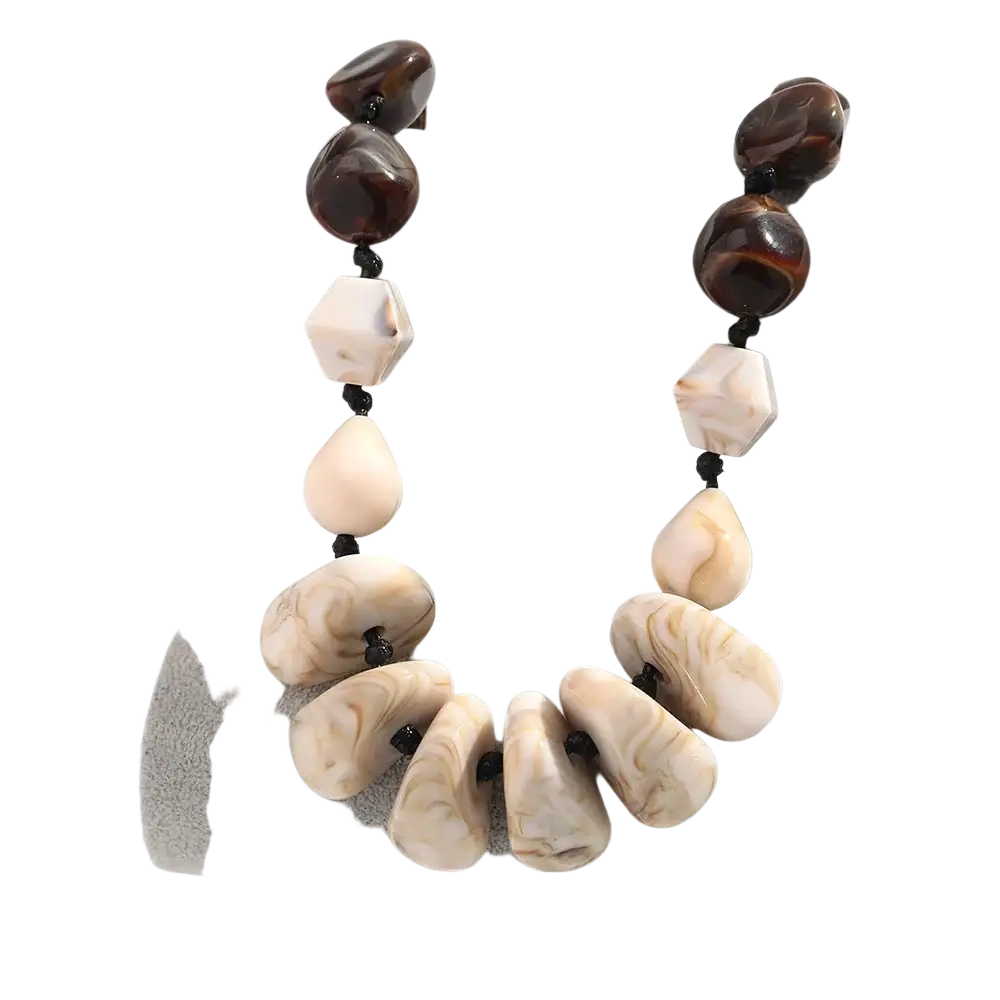 Resin geometric marbled beaded choker necklace with alternating dark brown glossy beads and cream-colored stones