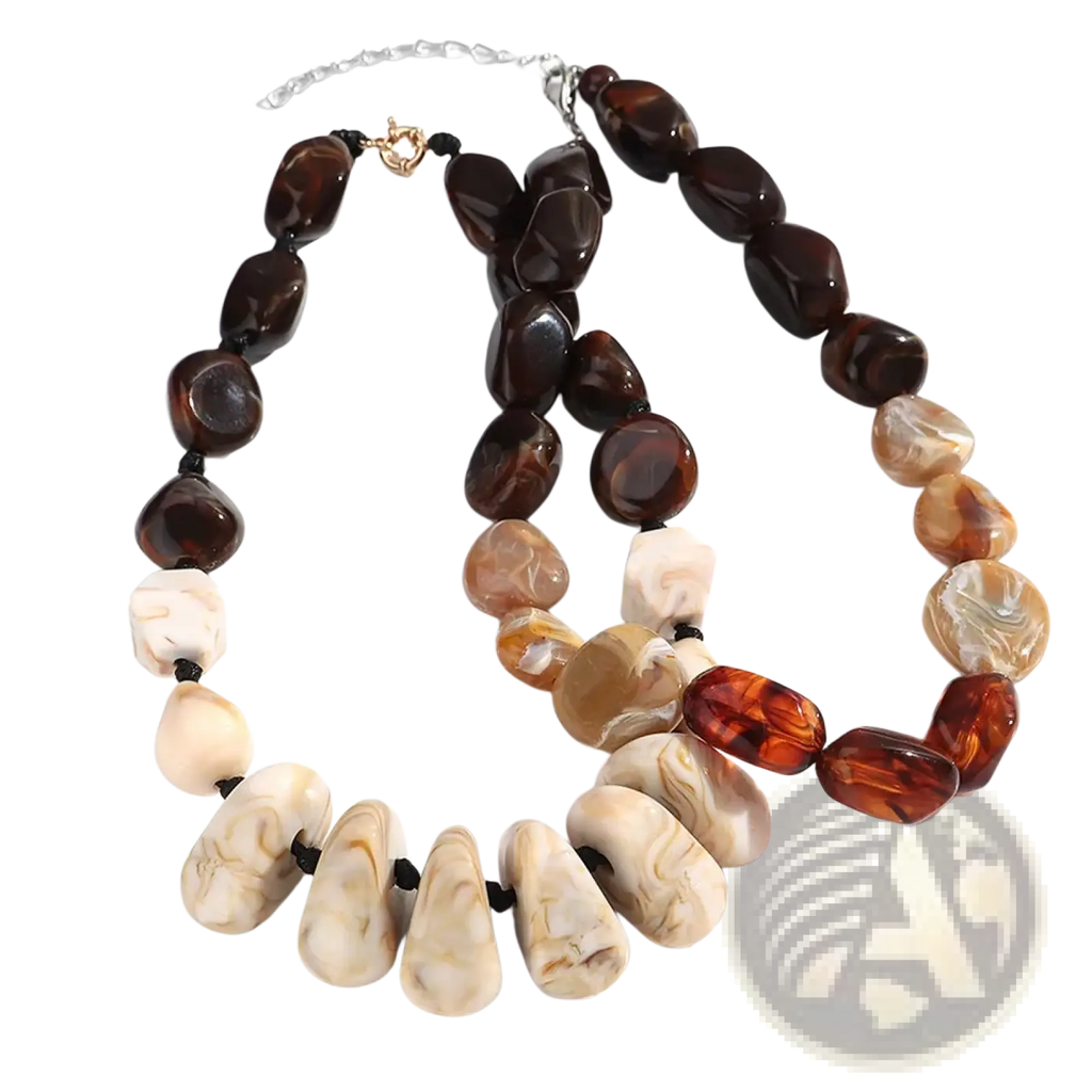 A resin geometric marbled beaded choker necklace with amber and cream resin beads on black cord with silver clasp