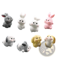 Set of eight resin rabbit figurines in pastel and gray colors with cute cartoonish features for Easter garden decor