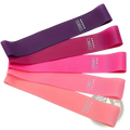 Set of five colorful silicone resistance bands in gradient shades from deep purple to light pink labeled by weight level