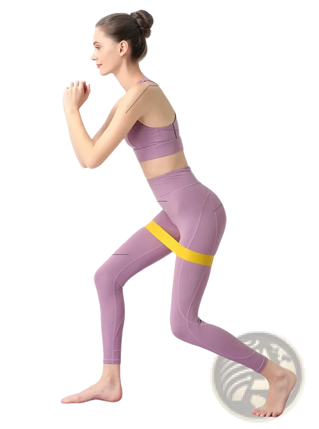 Lavender athletic leggings with a yellow resistance band around the hips for fitness and Pilates workout use