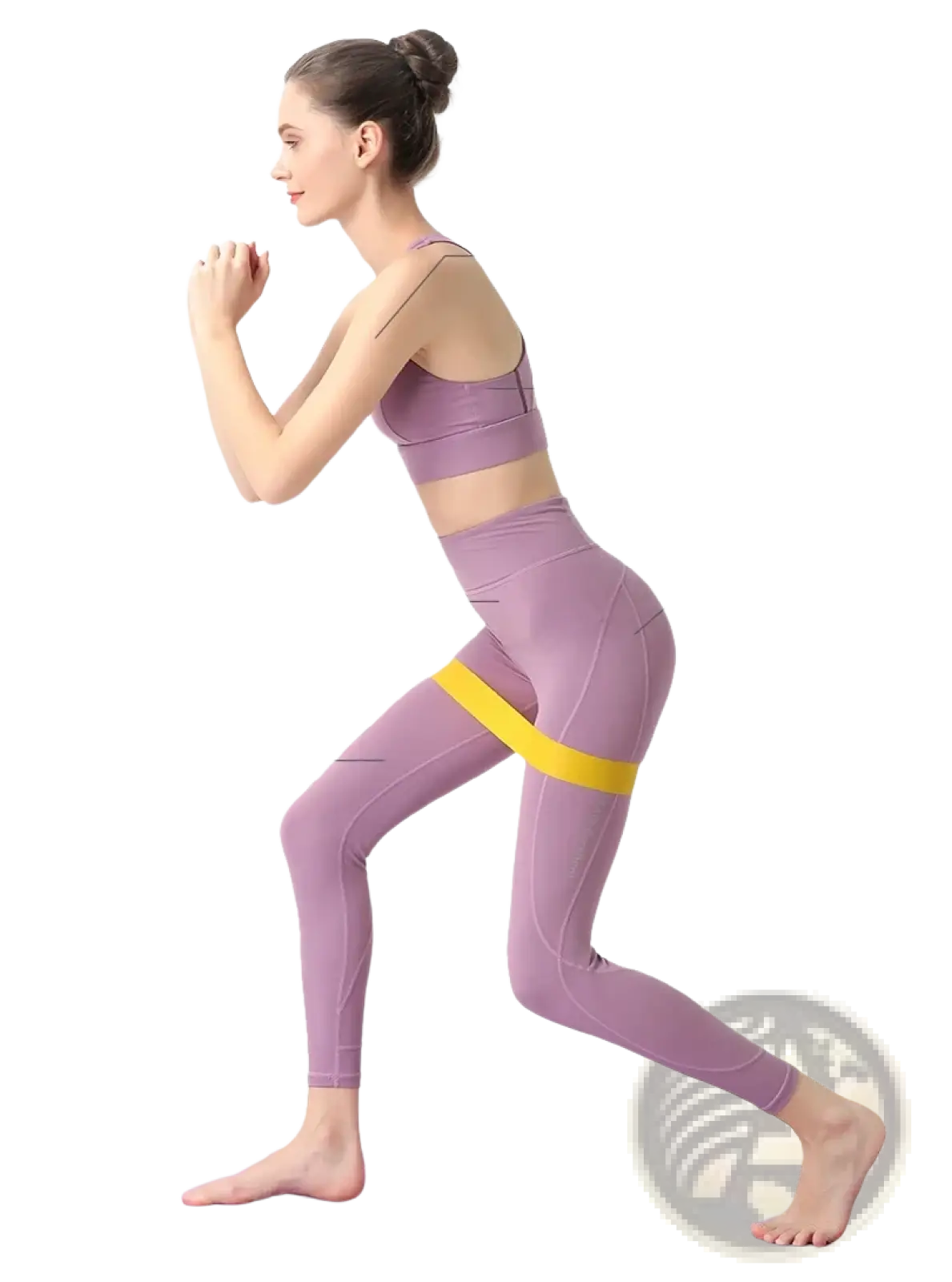 Lavender athletic leggings with a yellow resistance band around the hips for fitness and Pilates workout use