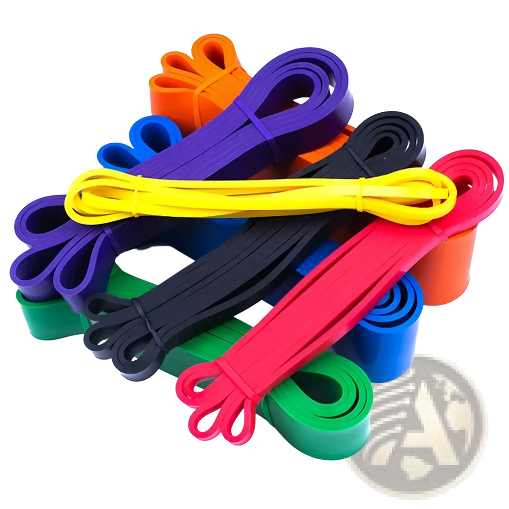 A set of colorful resistance bands in vibrant hues including orange purple yellow black red green and blue for fitness and training