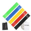 Set of five colorful tpe resistance bands in green blue yellow red and black for home fitness workout