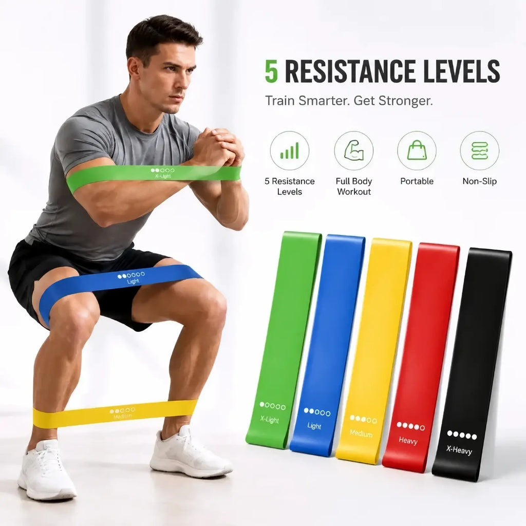 Resistance bands set of five colorful elastic bands in green blue yellow red and black for home fitness workouts