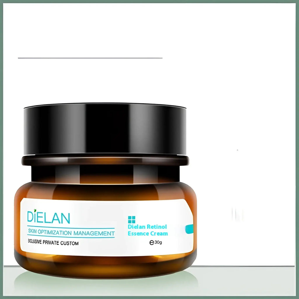 A sleek amber glass jar with a glossy black lid containing dielan retinol essence cream for anti-aging and firming
