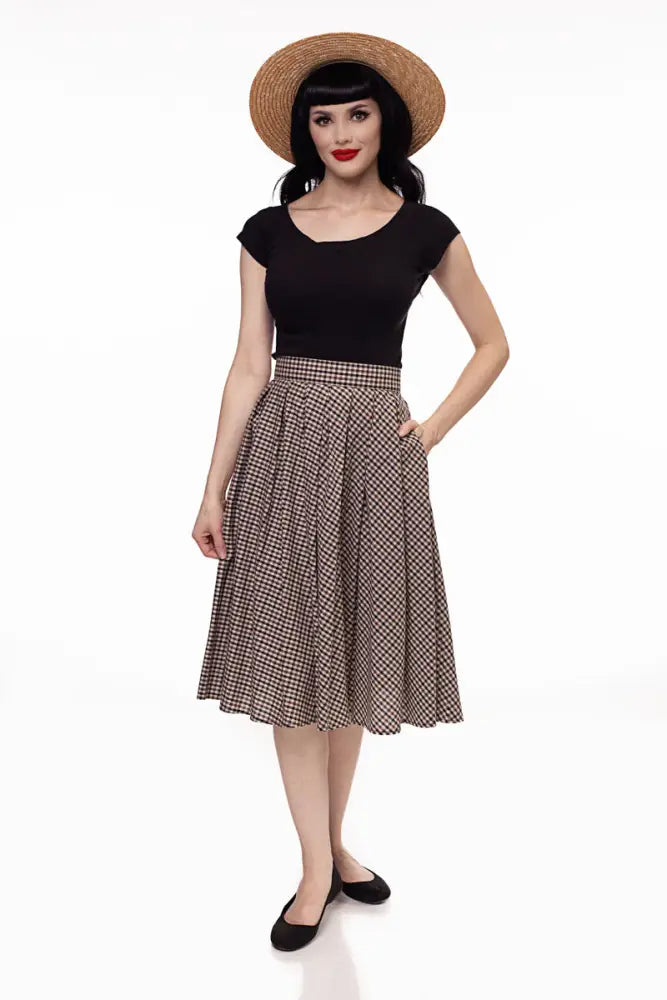 Black cap sleeve retro boat neck top paired with black and beige houndstooth a-line skirt with fitted waistband
