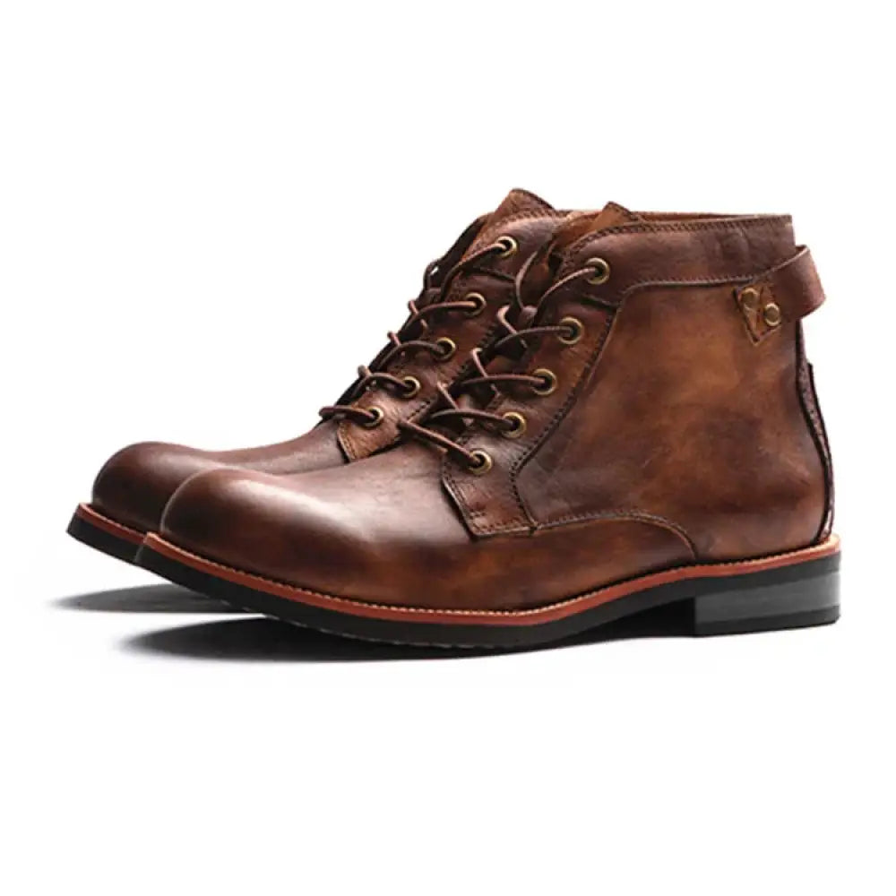Men’s retro brown leather chukka ankle boots with tan laces and a black sole for lace-up style and durability